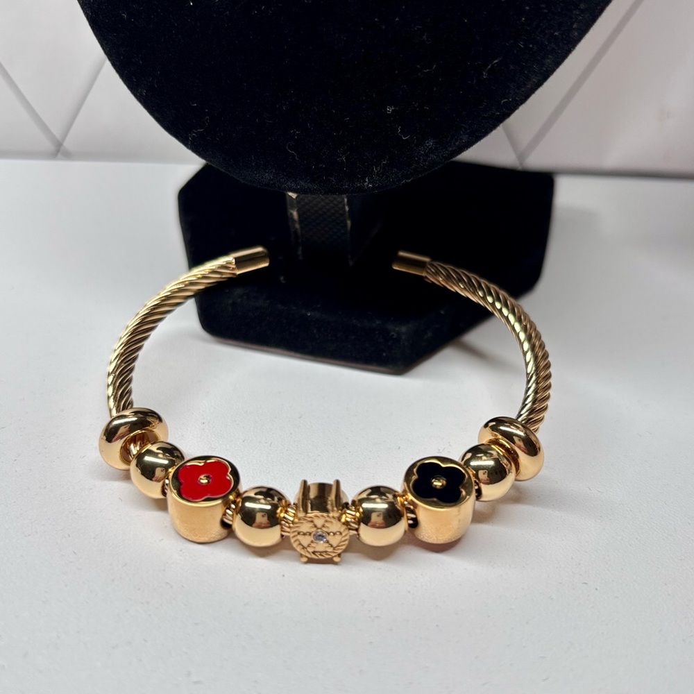 Gold-Tone Women's Floral Accent Bracelet with Red & Black Enamel
